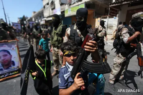 Palestinian Islamic Jihad supporters celebrate with people what they said was a victory over Israel, in Gaza City August 29, 2014. An open-ended ceasefire, mediated by Egypt, took effect on Tuesday evening. It called for...