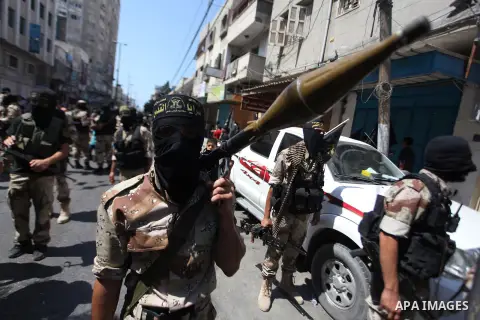 Palestinian Islamic Jihad supporters celebrate with people what they said was a victory over Israel, in Gaza City August 29, 2014. An open-ended ceasefire, mediated by Egypt, took effect on Tuesday evening. It called for...