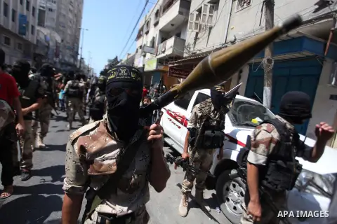 Palestinian Islamic Jihad supporters celebrate with people what they said was a victory over Israel, in Gaza City August 29, 2014. An open-ended ceasefire, mediated by Egypt, took effect on Tuesday evening. It called for...