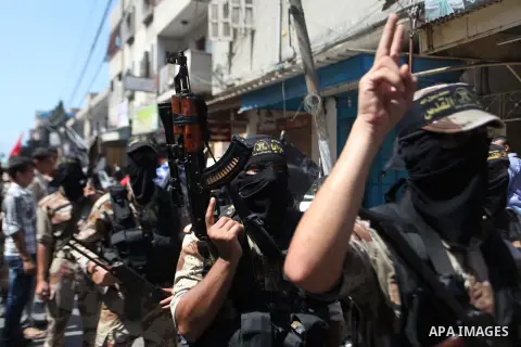 Palestinian Islamic Jihad supporters celebrate with people what they said was a victory over Israel, in Gaza City August 29, 2014. An open-ended ceasefire, mediated by Egypt, took effect on Tuesday evening. It called for...