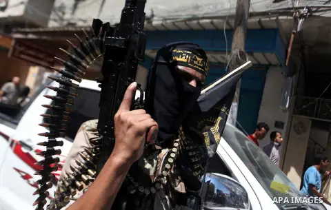 Palestinian Islamic Jihad supporters celebrate with people what they said was a victory over Israel, in Gaza City August 29, 2014. An open-ended ceasefire, mediated by Egypt, took effect on Tuesday evening. It called for...