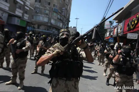 Palestinian Islamic Jihad supporters celebrate with people what they said was a victory over Israel, in Gaza City August 29, 2014. An open-ended ceasefire, mediated by Egypt, took effect on Tuesday evening. It called for...