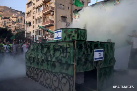 Palestinians who support the Islamic Hamas movement take part in a rally showing their support and solidarity with Hamas in the West Bank city of Nablus, 29 August 2014. An open-ended ceasefire, mediated by Egypt, took e...
