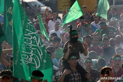 Palestinians who support the Islamic Hamas movement take part in a rally showing their support and solidarity with Hamas in the West Bank city of Nablus, 29 August 2014. An open-ended ceasefire, mediated by Egypt, took e...