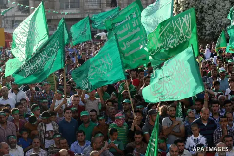 Palestinians who support the Islamic Hamas movement take part in a rally showing their support and solidarity with Hamas in the West Bank city of Nablus, 29 August 2014. An open-ended ceasefire, mediated by Egypt, took e...