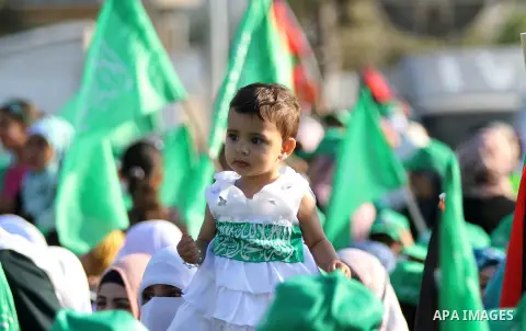 Palestinians who support the Islamic Hamas movement celebrate what they said was a victory by Palestinians in Gaza over Israel following a ceasefire, in the West Bank city of Ramallah August 30, 2014. An open-ended cease...