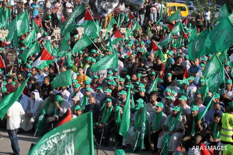 Palestinians who support the Islamic Hamas movement celebrate what they said was a victory by Palestinians in Gaza over Israel following a ceasefire, in the West Bank city of Ramallah August 30, 2014. An open-ended cease...