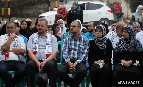 Palestinian Journalists's families take part in a ceremony honoring in Gaza city on 30 August 2014. An indefinite ceasefire to end seven weeks of fighting between Israel and Palestinian militant groups in the Gaza Strip...