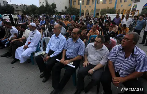 Palestinian Journalists's families take part in a ceremony honoring in Gaza city on 30 August 2014. An indefinite ceasefire to end seven weeks of fighting between Israel and Palestinian militant groups in the Gaza Strip...