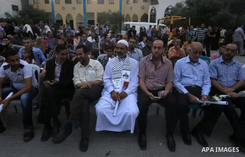 Palestinian Journalists's families take part in a ceremony honoring in Gaza city on 30 August 2014. An indefinite ceasefire to end seven weeks of fighting between Israel and Palestinian militant groups in the Gaza Strip...