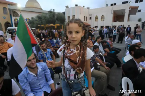 A Palestinian girl take part in a ceremony honoring to Palestinian journalists's families take part in a ceremony honoring in Gaza city on 30 August 2014. An indefinite ceasefire to end seven weeks of fighting between Is...