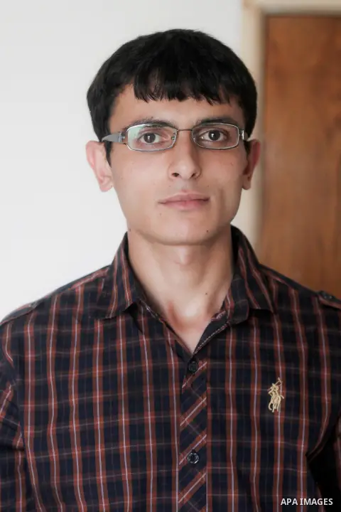 Khalil Awawdeh, a Palestinian inventor who works at his room in the West Bank city of Hebron on August 31, 2014. The 22-year-old man invents explosives detection device and he uses a cartoon to makes military tanks. Phot...