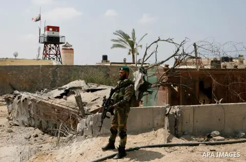 Palestinian security forces inspect security headquarters destroyed during fighting between Hamas militants and Israel on the border between Egypt and Gaza in Rafah, southern Gaza Strip in August 31, 2014. An indefinite...