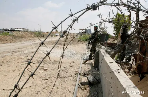 Palestinian security forces inspect security headquarters destroyed during fighting between Hamas militants and Israel on the border between Egypt and Gaza in Rafah, southern Gaza Strip in August 31, 2014. An indefinite...