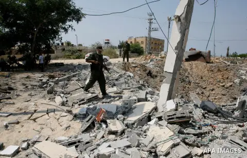 Palestinian security forces inspect security headquarters destroyed during fighting between Hamas militants and Israel on the border between Egypt and Gaza in Rafah, southern Gaza Strip in August 31, 2014. An indefinite...
