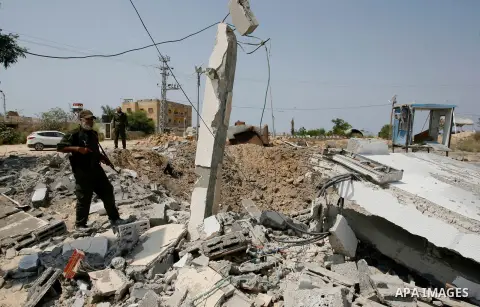 Palestinian security forces inspect security headquarters destroyed during fighting between Hamas militants and Israel on the border between Egypt and Gaza in Rafah, southern Gaza Strip in August 31, 2014. An indefinite...