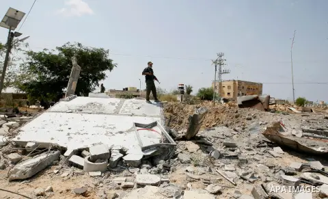 Palestinian security forces inspect security headquarters destroyed during fighting between Hamas militants and Israel on the border between Egypt and Gaza in Rafah, southern Gaza Strip in August 31, 2014. An indefinite...