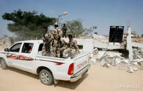 Palestinian security forces inspect security headquarters destroyed during fighting between Hamas militants and Israel on the border between Egypt and Gaza in Rafah, southern Gaza Strip in August 31, 2014. An indefinite...