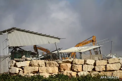 Israeli bulldozers demolish a dairy factory, at the al-Rama neighborhood near the West Bank city of Hebron on September 2, 2014. Israeli bulldozers demolished a dairy factory in Hebron and Bedouin homes east of Jerusalem...