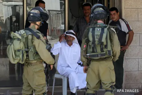 Israeli military patrol the streets during a military operation at Al-Nassariya village near the West Bank city of Nablus, on Sep. 04, 2014. Photo by Nedal Eshtayah