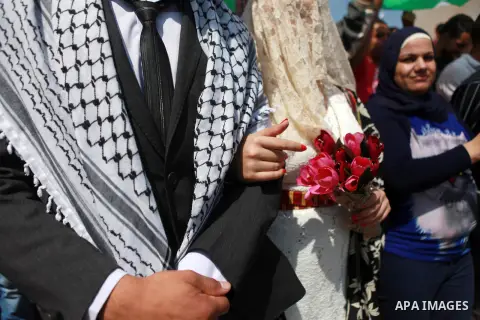 Palestinians take part in a representation wedding ceremony to refused what they say is land confiscation for Jewish settlements village of Qaryout, near the West Bank City of Nablus on Sep. 05, 2014. Photo by Shadi Hate...