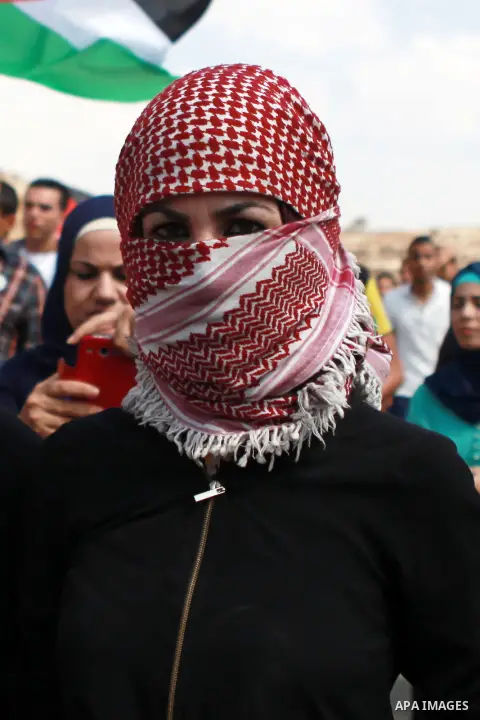 A Palestinian girl takes part in a representation wedding ceremony to refused what they say is land confiscation for Jewish settlements village of Qaryout, near the West Bank City of Nablus on Sep. 05, 2014. Photo by Sha...