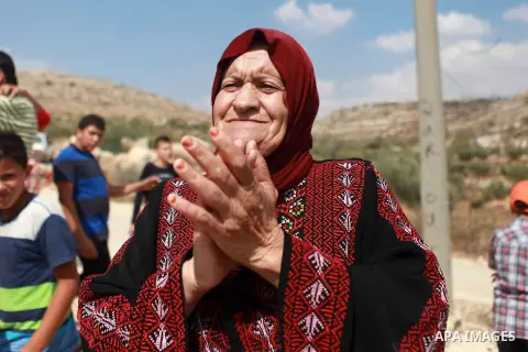 A Palestinian woman takes part in a representation wedding ceremony to refused what they say is land confiscation for Jewish settlements village of Qaryout, near the West Bank City of Nablus on Sep. 05, 2014. Photo by Sh...