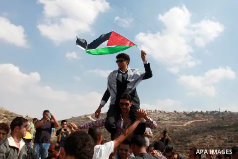 Palestinians take part in a representation wedding ceremony to refused what they say is land confiscation for Jewish settlements village of Qaryout, near the West Bank City of Nablus on Sep. 05, 2014. Photo by Shadi Hate...