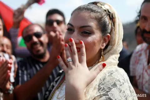 Palestinians take part in a representation wedding ceremony to refused what they say is land confiscation for Jewish settlements village of Qaryout, near the West Bank City of Nablus on Sep. 05, 2014. Photo by Shadi Hate...