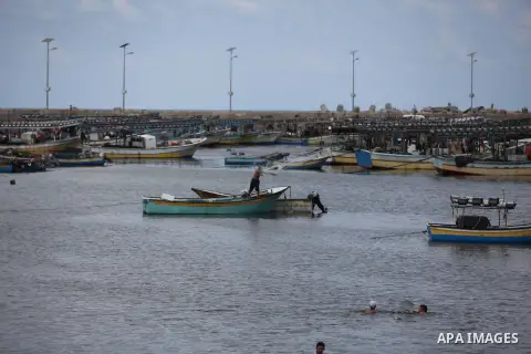 Palestinian fishermen cast their nets at Gaza's seaport in Gaza City on Sep. 06 2014. Israel and Hamas accepted an Egyptian proposal for a long-term ceasefire in war-torn Gaza. Restrictions imposed on Gaza fishermen are...