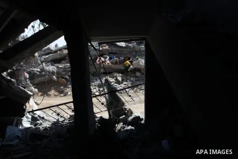 Palestinians gather around the the remains of their house that witnesses said were destroyed in an Israeli offensive, after a ceasefire was declared in the Shejaia neighbourhood, east of Gaza City. September 6, 2014. Cal...