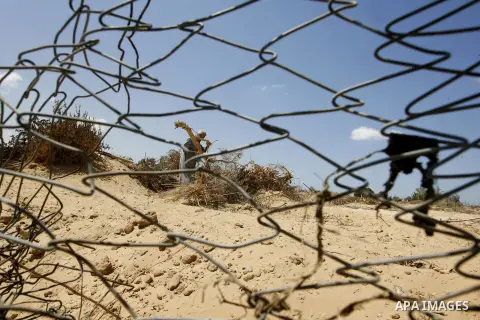 A Palestinian man inspects his farmland which destroyed during fighting between Hamas militants and Israel in east of Rafah in southern Gaza strip on September 07, 2014. Calm returned to the coastal enclave in a August 2...