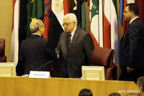 Palestinian President Mahmoud Abbas gestures before a meeting of foreign ministers at the headquarters of the Arab League in the Egyptian capital Cairo on September 7, 2014. According to media sources among other topic t...