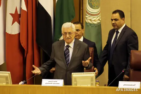 Palestinian President Mahmoud Abbas gestures before a meeting of foreign ministers at the headquarters of the Arab League in the Egyptian capital Cairo on September 7, 2014. According to media sources among other topic t...