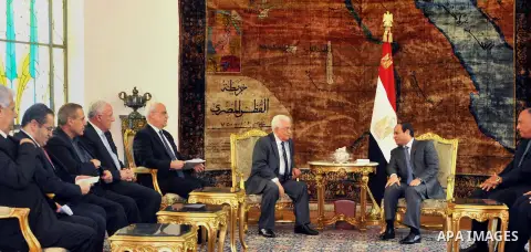 A handout photo made available by the Egyptian Presidency shows Egyptian President Abdel Fattah el-Sissi, meets Palestinian President Mahmoud Abbas, center and Saeb Erekat, chief Palestinian negotiator at the presidentia...