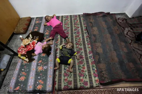 Palestinian displaced children sleep at a UN school in Beit Hanoun in northern Gaza strip on Sep. 07, 2014. Calm returned to the coastal enclave in a August 26 ceasefire, and Gazans were gradually starting to rebuild the...