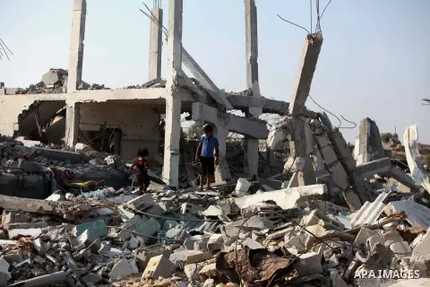 A Palestinian boy walks past the rubble of his house which destroyed during fighting between Hamas militants and Israel in the center of Gaza strip on September 08, 2014. Calm returned to the coastal enclave in a August...