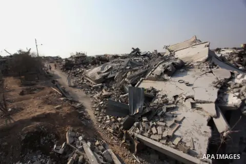 Palestinians gather around the rubble of his house which destroyed during fighting between Hamas militants and Israel in the center of Gaza strip on September 08, 2014. Calm returned to the coastal enclave in a August 26...
