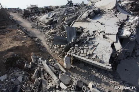 A Palestinian man stands on the rubble of her house which destroyed during fighting between Hamas militants and Israel in the center of Gaza strip on September 08, 2014. Calm returned to the coastal enclave in a August 2...