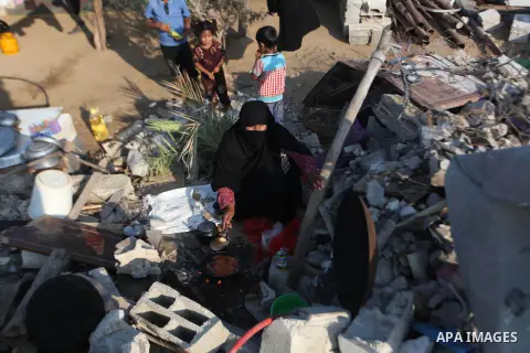 A Palestinian Bedouin stands on the rubble of her house which destroyed during fighting between Hamas militants and Israel in the center of Gaza strip on September 08, 2014. Calm returned to the coastal enclave in a Augu...