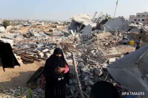 A Palestinian Bedouin stands on the rubble of her house which destroyed during fighting between Hamas militants and Israel in the center of Gaza strip on September 08, 2014. Calm returned to the coastal enclave in a Augu...