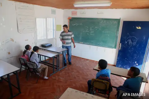 Palestinian Bedouin Students learn at Arab Al-Ka'abneh school in Al-Mu'arrajat area near the West Bank city of Jericho, on Sep. 08, 2014. Dozens of Palestinian children in the ramshackle Bedouin community outside Jerusal...