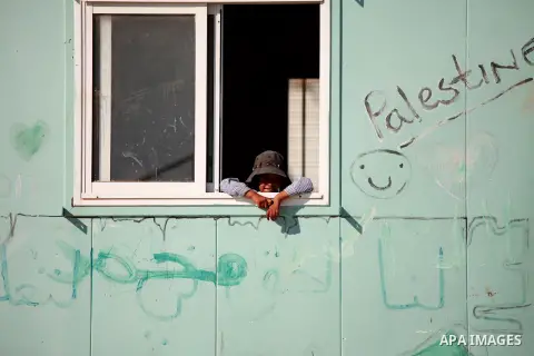 A Palestinian Bedouin Student learns at Arab Al-Ka'abneh school in Al-Mu'arrajat area near the West Bank city of Jericho, on Sep. 08, 2014. Dozens of Palestinian children in the ramshackle Bedouin community outside Jerus...