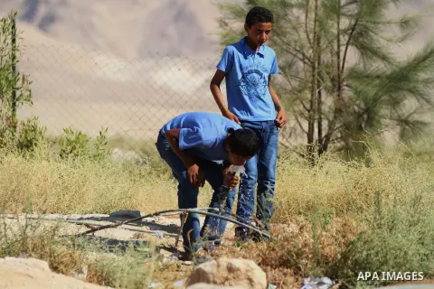 Palestinian Bedouin Students drink water at Arab Al-Ka'abneh school in Al-Mu'arrajat area near the West Bank city of Jericho, on Sep. 08, 2014. Dozens of Palestinian children in the ramshackle Bedouin community outside J...