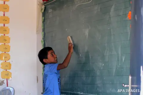 A Palestinian Bedouin Student learns at Arab Al-Ka'abneh school in Al-Mu'arrajat area near the West Bank city of Jericho, on Sep. 08, 2014. Dozens of Palestinian children in the ramshackle Bedouin community outside Jerus...