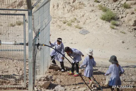 Palestinian Bedouin Students drink water at Arab Al-Ka'abneh school in Al-Mu'arrajat area near the West Bank city of Jericho, on Sep. 08, 2014. Dozens of Palestinian children in the ramshackle Bedouin community outside J...