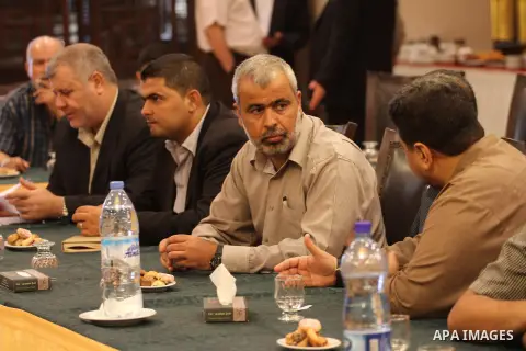 Members of Palestinian factions speak during a press conference in Gaza city, on Sep. 10, 2014. Photo by Mohammed Asad