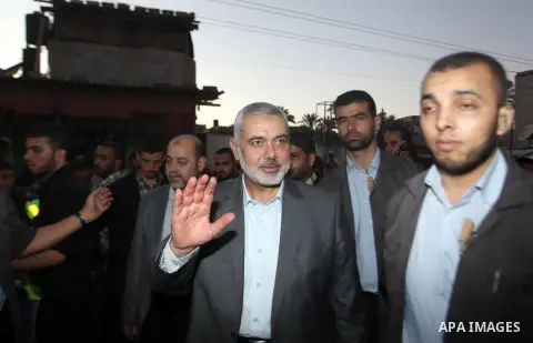 Senior leader of Hamas Ismail Haniyeh gets welcome during his inspection visit to the Deir al-Balah in the central Gaza Strip, on September 10, 2014. Hamas's exiled deputy leader said Wednesday that indirect talks with I...