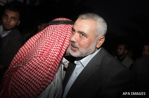 Senior leader of Hamas Ismail Haniyeh gets welcome during his inspection visit to the Deir al-Balah in the central Gaza Strip, on September 10, 2014. Hamas's exiled deputy leader said Wednesday that indirect talks with I...