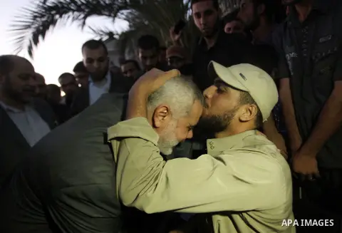 Senior leader of Hamas Ismail Haniyeh gets welcome during his inspection visit to the Deir al-Balah in the central Gaza Strip, on September 10, 2014. Hamas's exiled deputy leader said Wednesday that indirect talks with I...